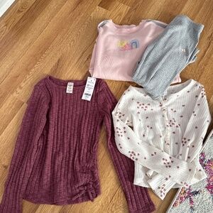 Two long sleeve kids shirts and one outfit